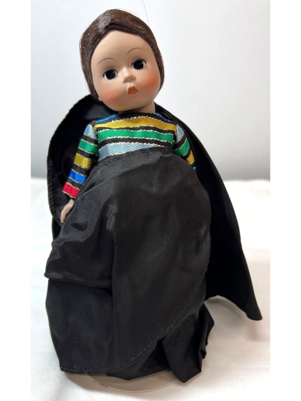Madame Alexander Collectible Doll With Black Cape & Colorful Striped Dress